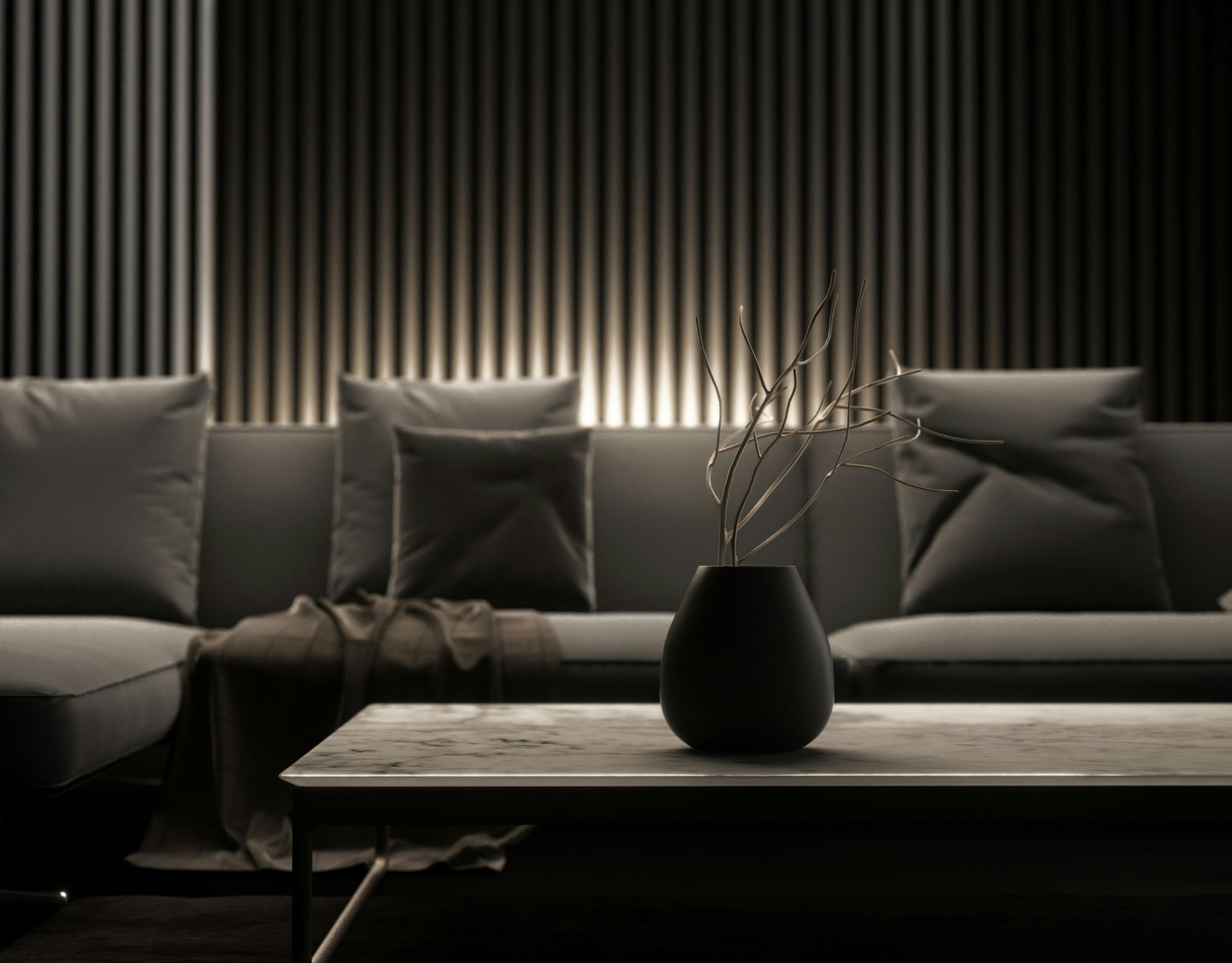 Warm LED Up-lighting on a charcoal textured stone wall in a luxury living room