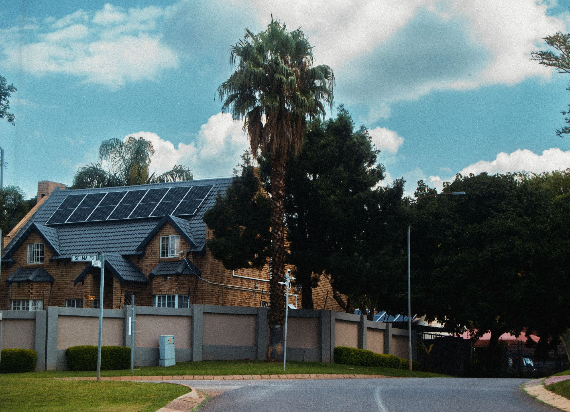 Residential home with integrated solar panel system for sustainable grid-independence.